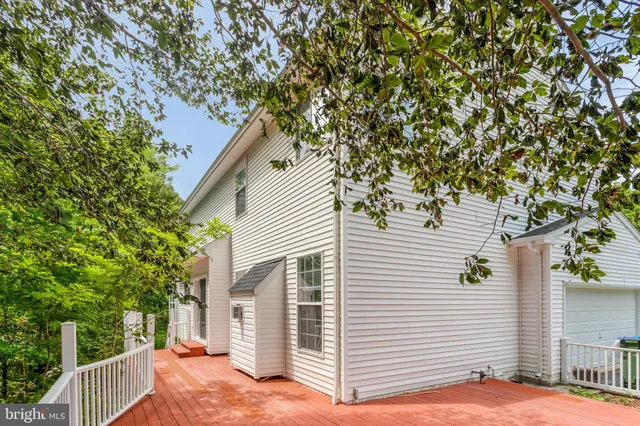 a view of a house with a tree