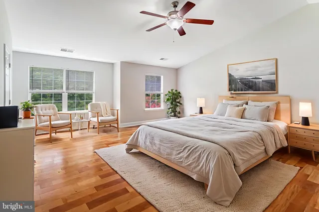 a spacious bedroom with a large bed and a couch