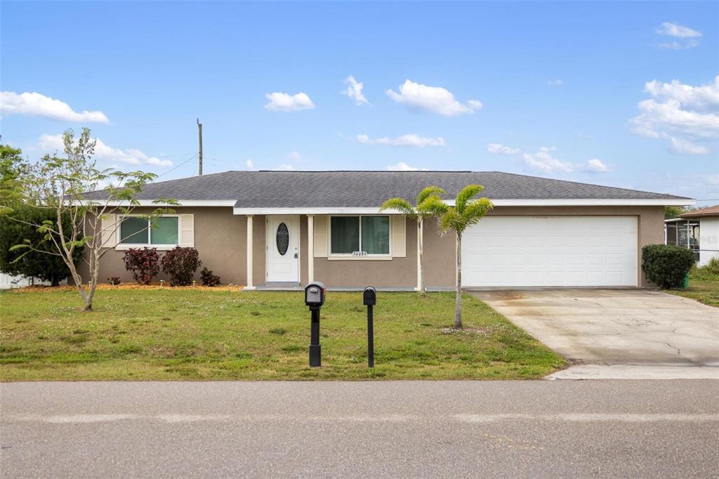 30089 Oak Road Punta Gorda, FL 33982 - Photo 1 of 1 a front view of a house with a yard