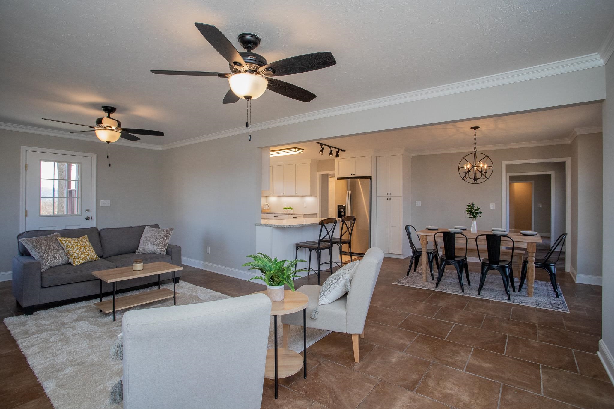 776 Chestnut Ridge Road Staunton, VA 24401 - Photo 19 of 73 a living room with furniture and a chandelier