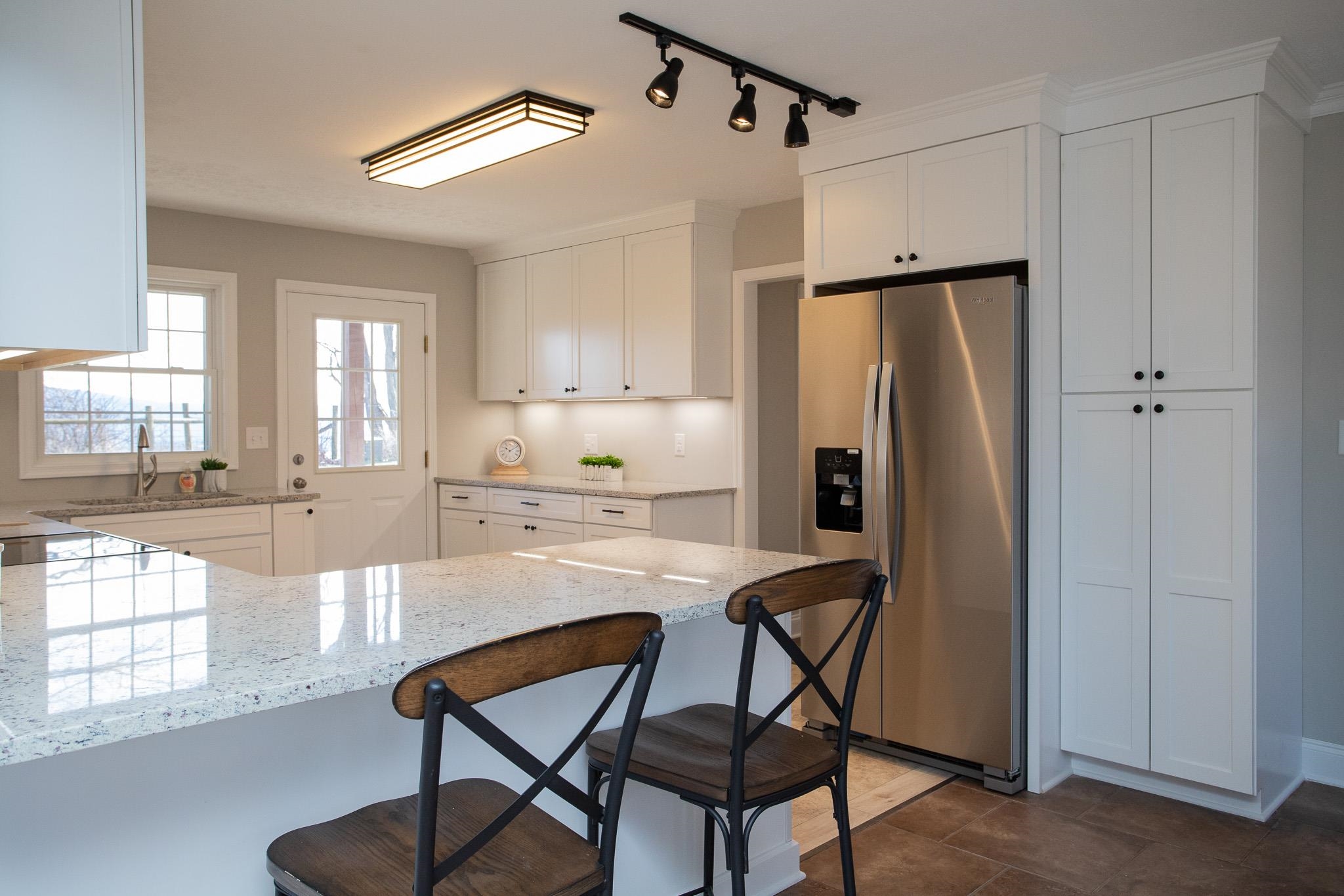 776 Chestnut Ridge Road Staunton, VA 24401 - Photo 23 of 73 a kitchen with stainless steel appliances a refrigerator and a table