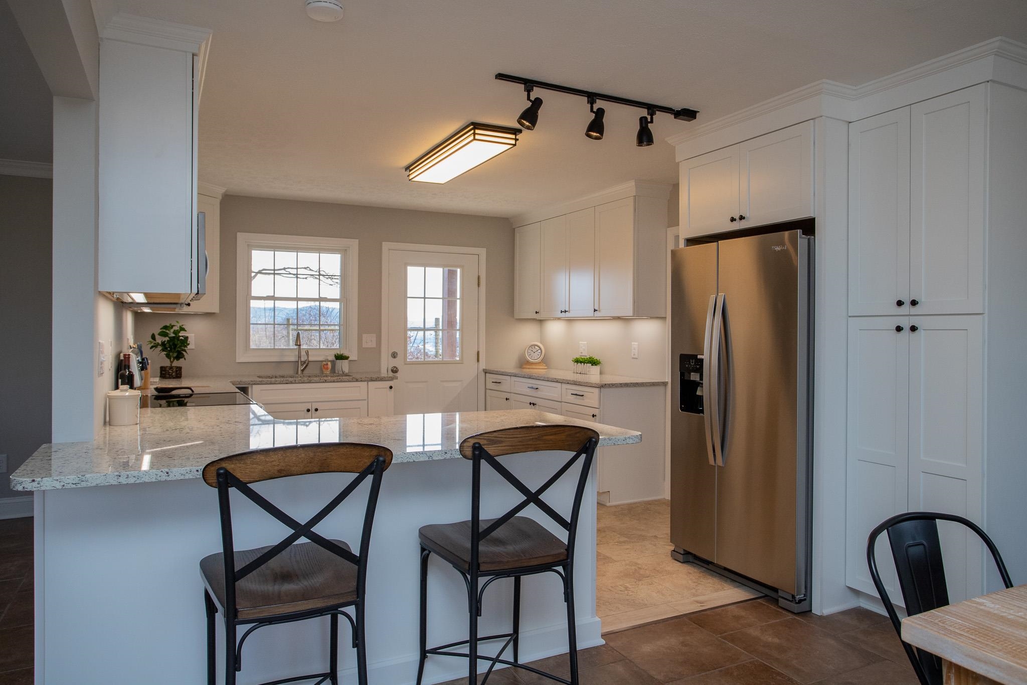 776 Chestnut Ridge Road Staunton, VA 24401 - Photo 24 of 73 a kitchen with stainless steel appliances a refrigerator a table and chairs in it
