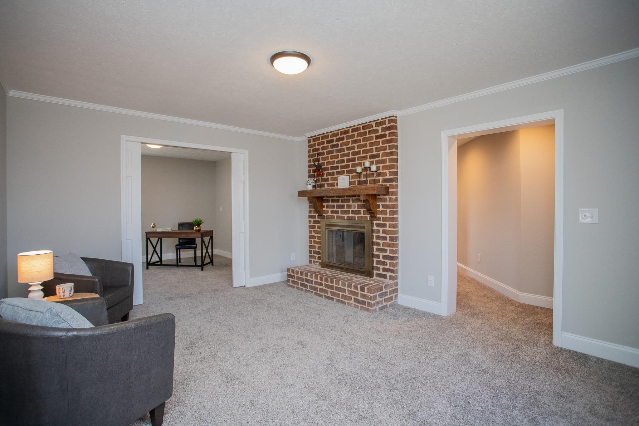 776 Chestnut Ridge Road Staunton, VA 24401 - Photo 38 of 73 a living room with furniture and a fireplace