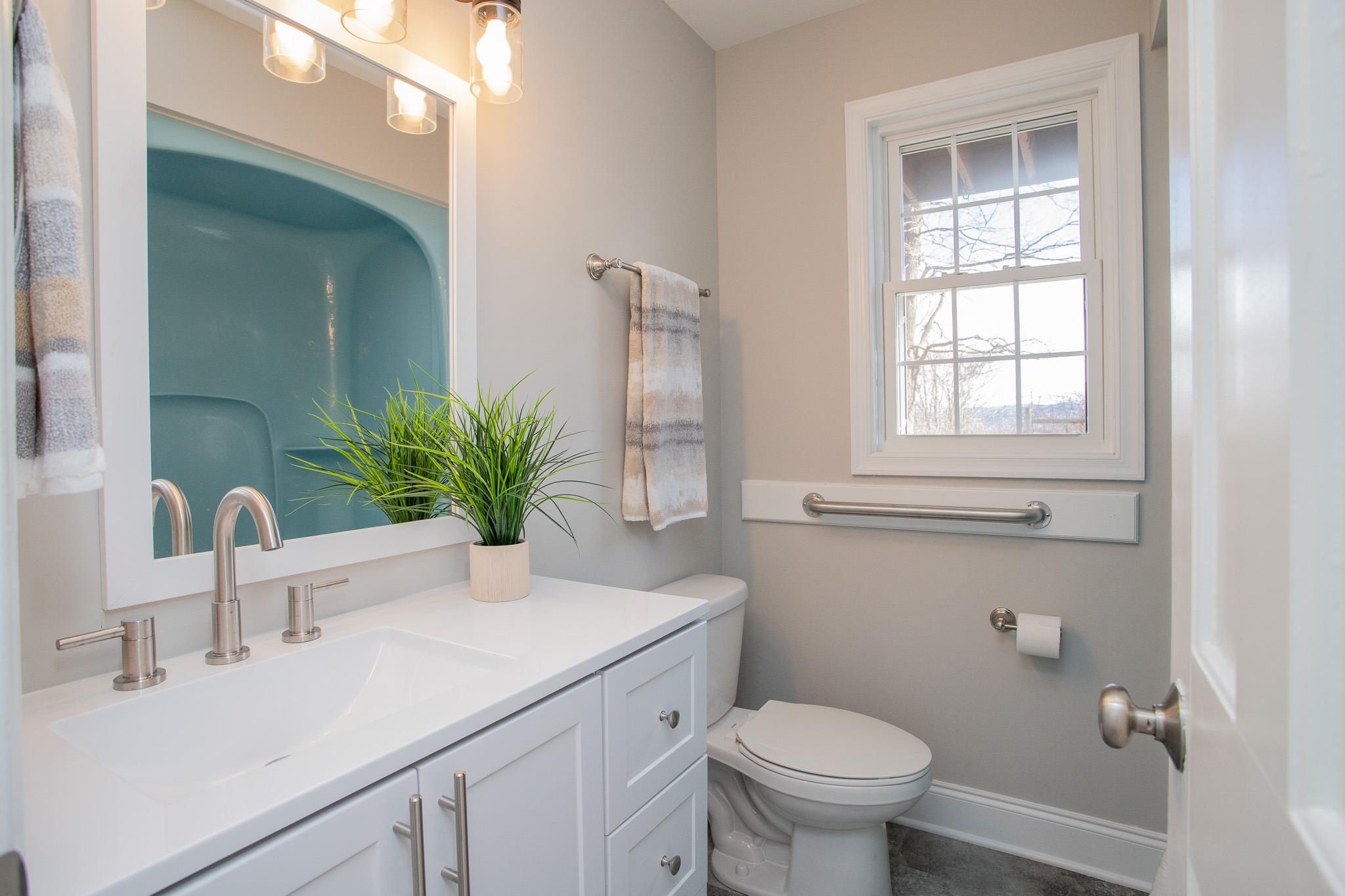776 Chestnut Ridge Road Staunton, VA 24401 - Photo 43 of 73 a bathroom with a sink a toilet and a mirror