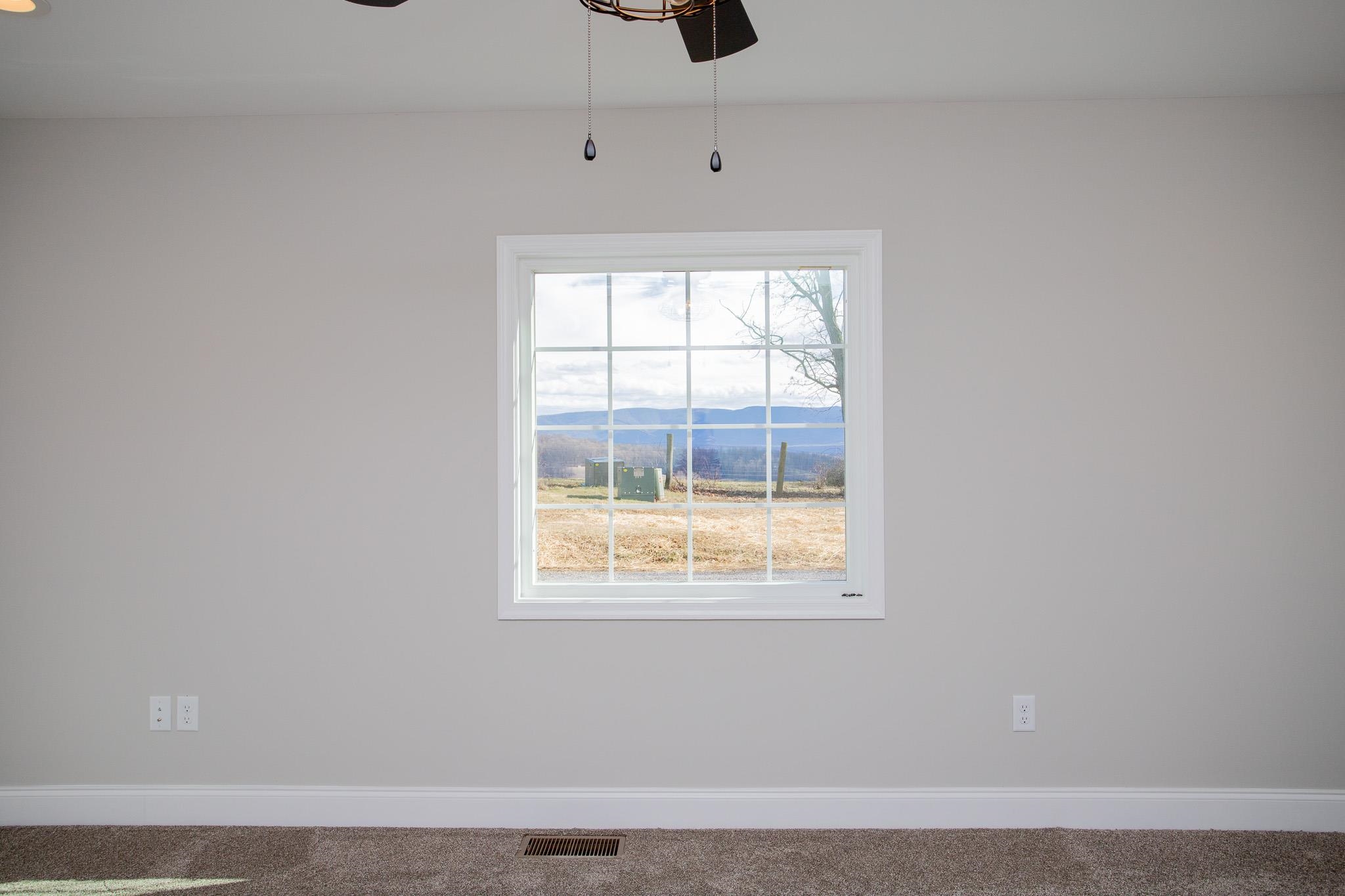 776 Chestnut Ridge Road Staunton, VA 24401 - Photo 46 of 73 a view of an empty room with wooden floor and windows