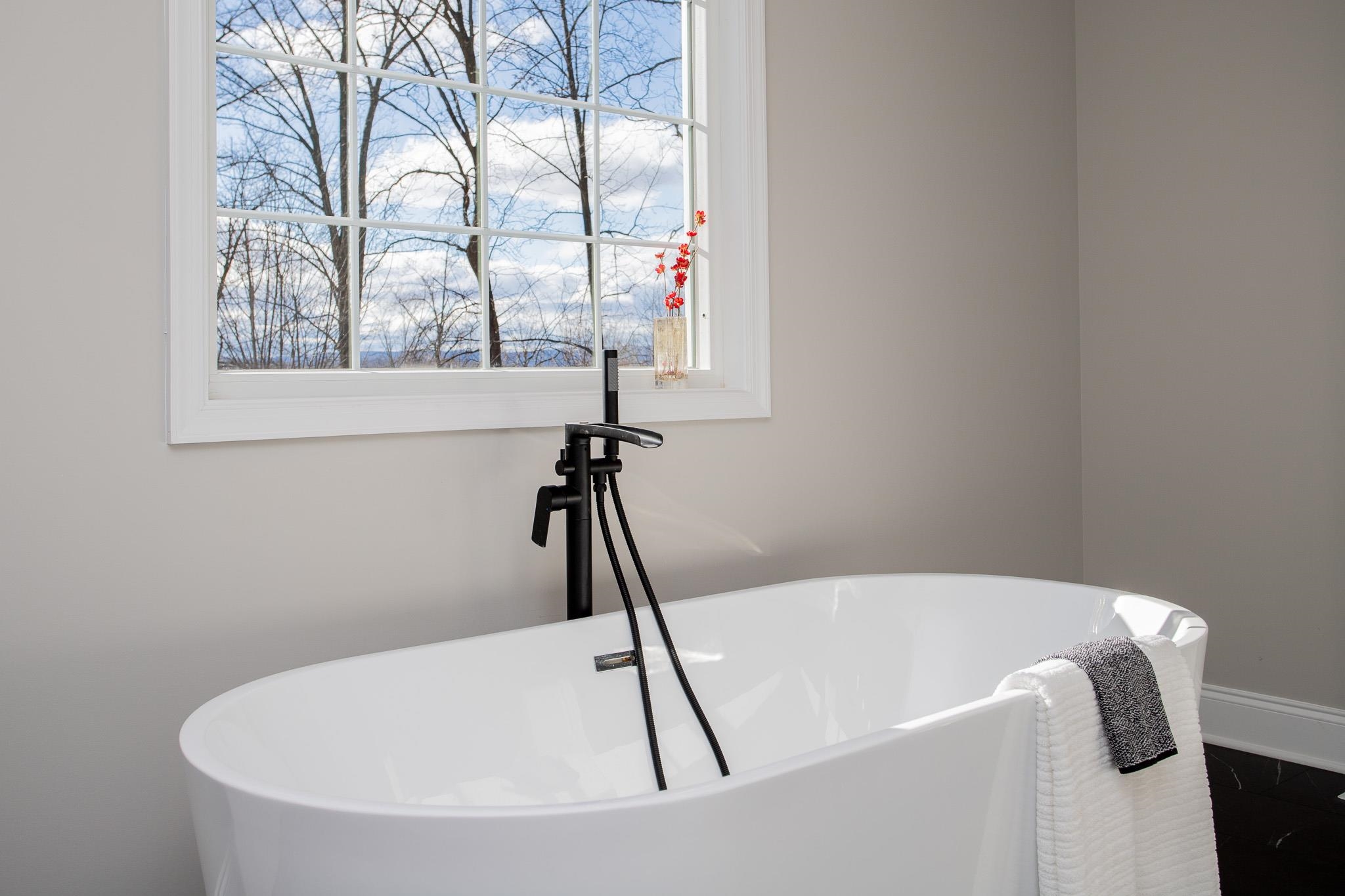 776 Chestnut Ridge Road Staunton, VA 24401 - Photo 50 of 73 a white bath tub sitting in a bathroom