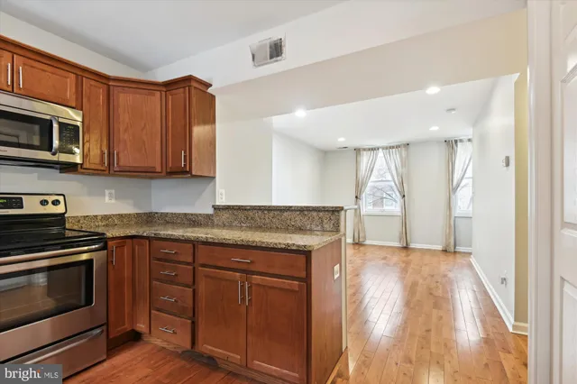 a view of a hallway with washer and dryer