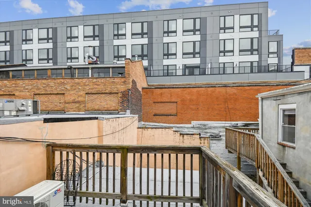 a balcony view with a outdoor seating space