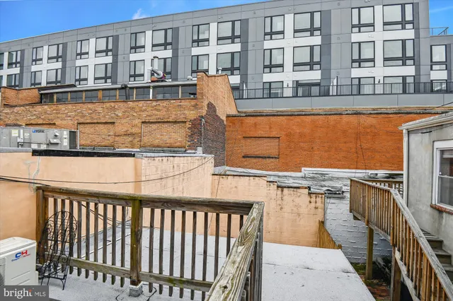 a balcony view with a sink