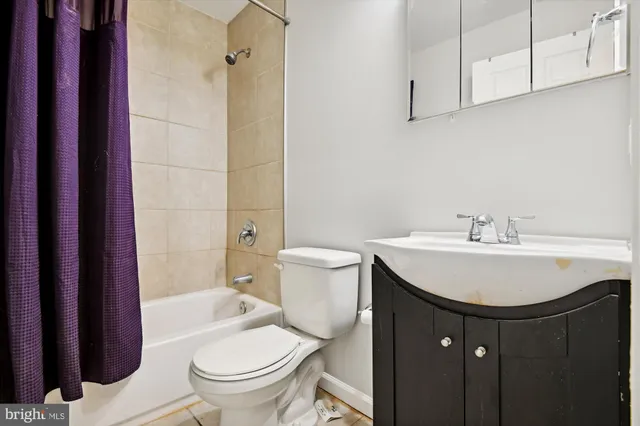 a view of storage and utility room with washer and dryer