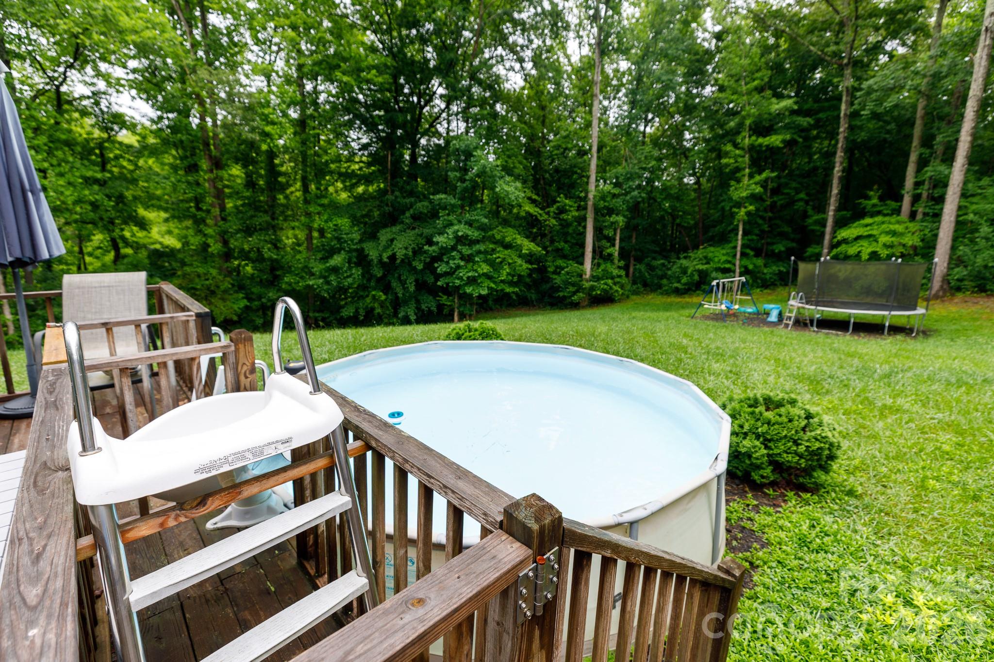 652 Sutton Spring Road York, SC 29745 - Photo 24 of 28 a view of a patio with a table and chairs