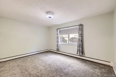 an empty room with a empty space and window
