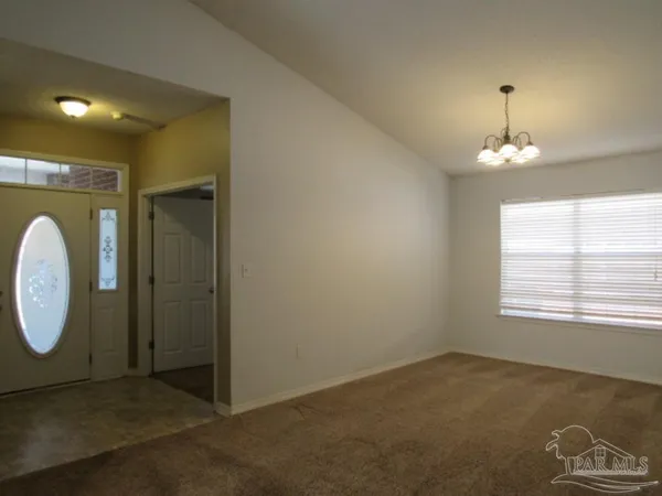 a kitchen with a sink a microwave a refrigerator and cabinets