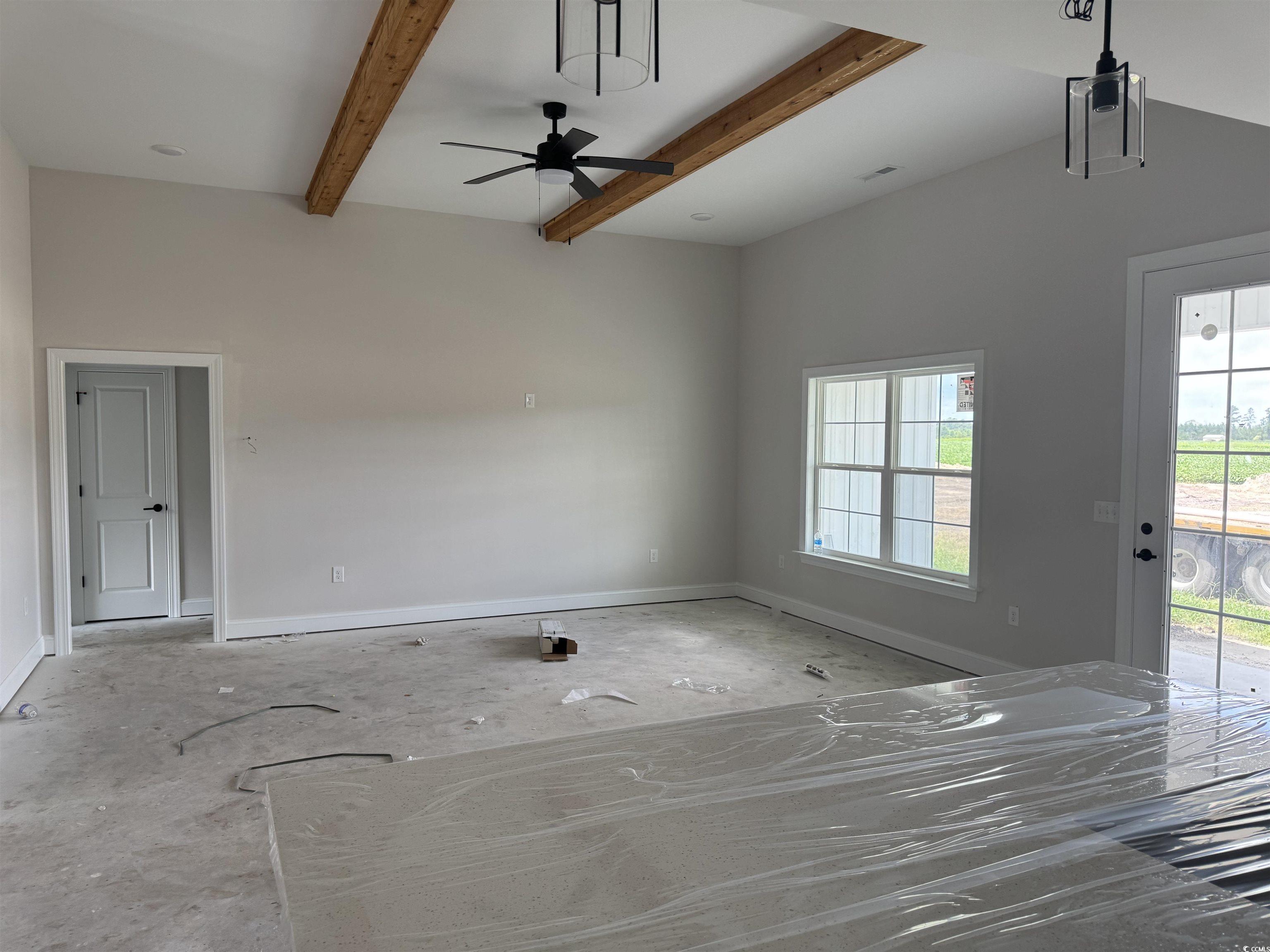 4971 Dupont Road Aynor, SC 29511 - Photo 6 of 12 Unfurnished living room with ceiling fan and beamed ceiling