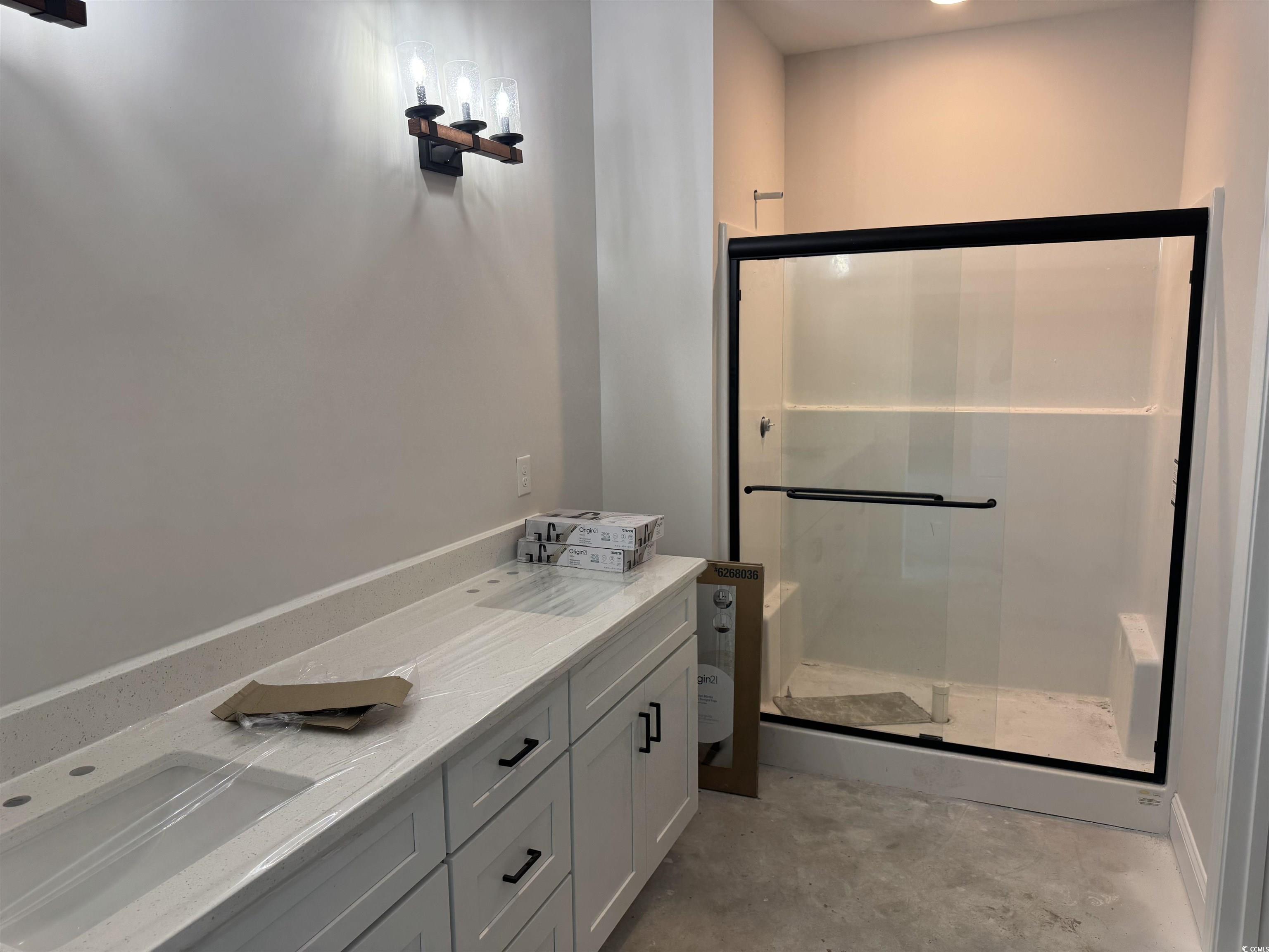 4971 Dupont Road Aynor, SC 29511 - Photo 8 of 12 Full bath featuring a shower stall, unfinished concrete flooring, and vanity
