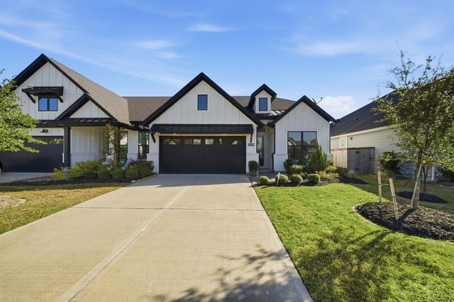 a front view of a house with yard porch and green space