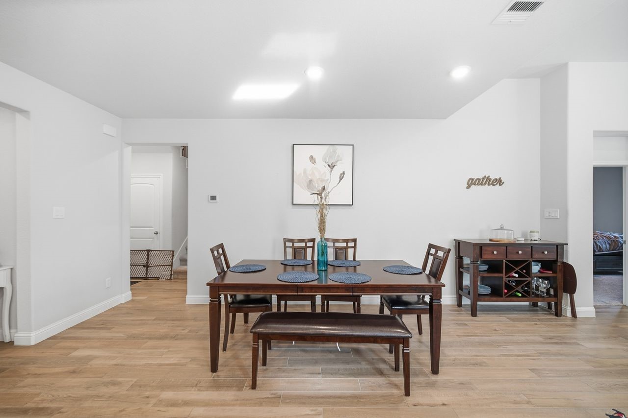 15326 Leal Rancho Court Cypress, TX 77433 - Photo 13 of 31 a view of a dining room with furniture