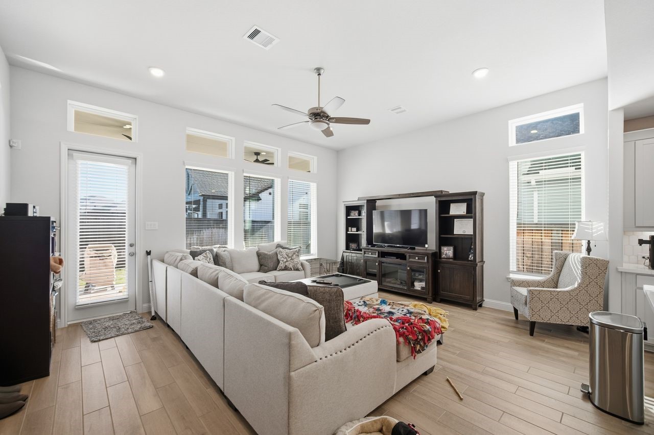 15326 Leal Rancho Court Cypress, TX 77433 - Photo 15 of 31 a living room with furniture and a flat screen tv
