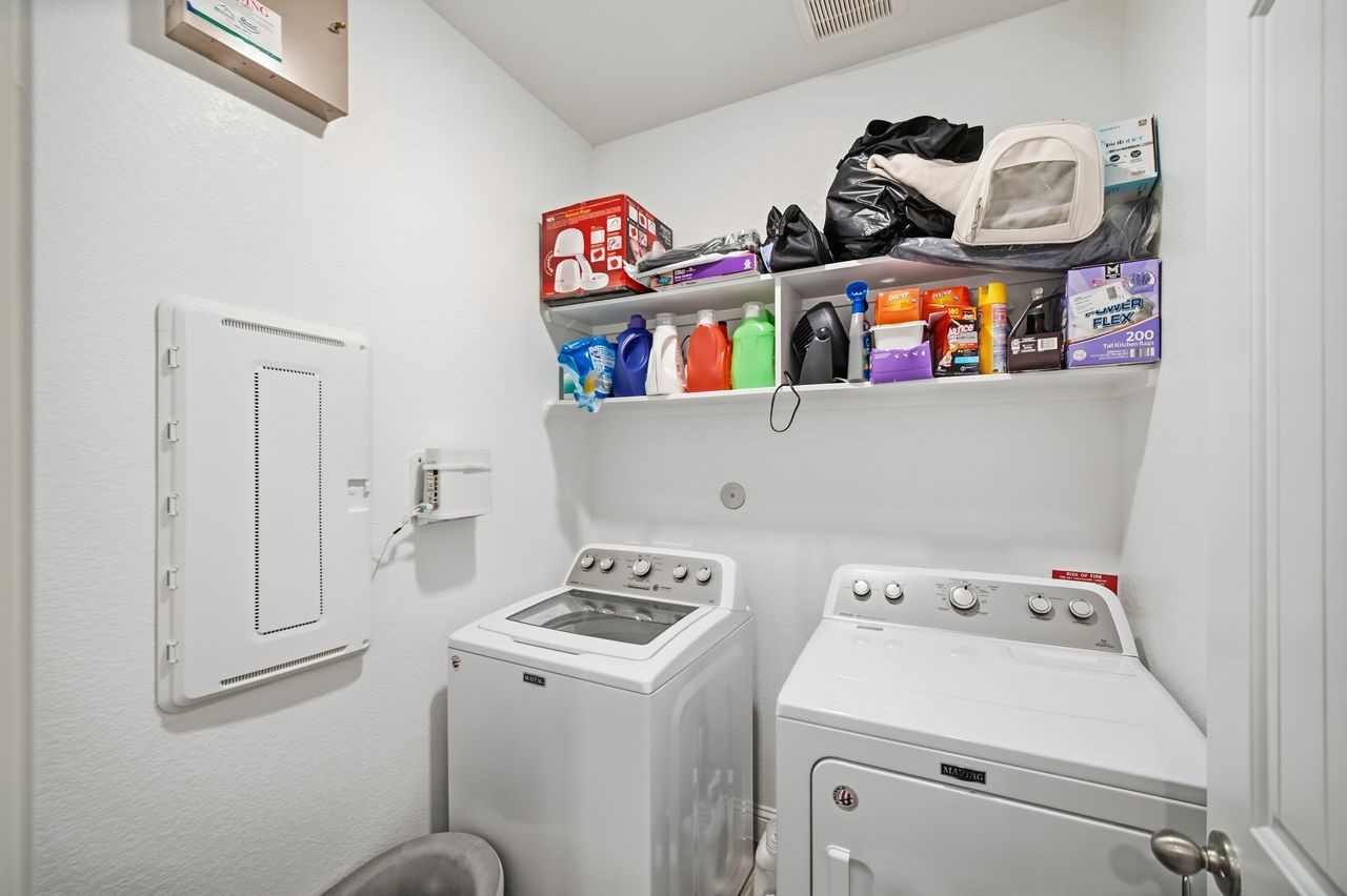 15326 Leal Rancho Court Cypress, TX 77433 - Photo 23 of 31 a utility room with dryer and washer
