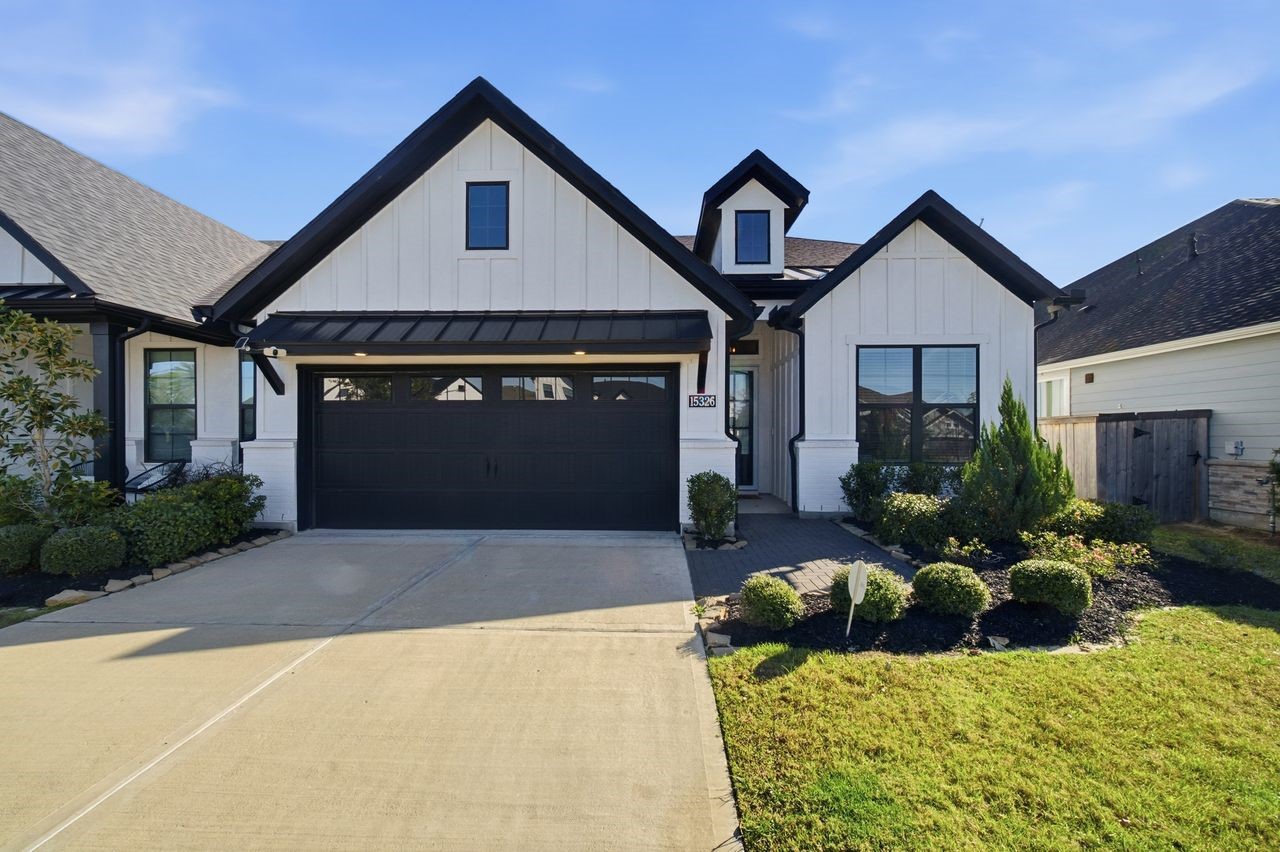 15326 Leal Rancho Court Cypress, TX 77433 - Photo 4 of 31 a front view of a house with a yard
