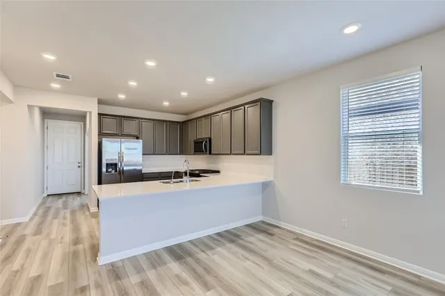 a view of kitchen with wooden floor