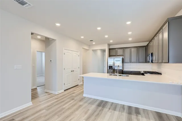 a view of kitchen with wooden floor