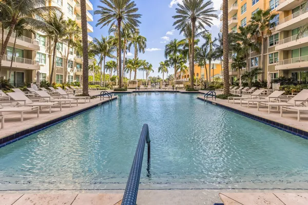a view of swimming pool with outdoor seating