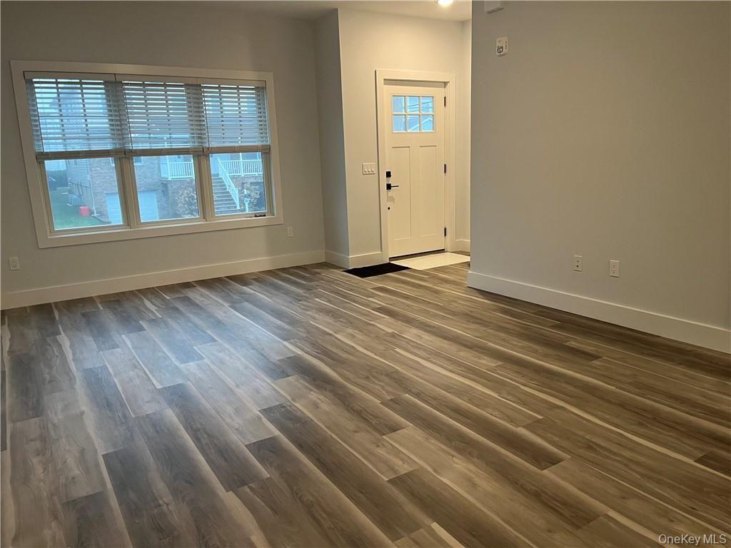 195 Park Avenue, Unit C West Harrison, NY 10604 - Photo 12 of 32 Entryway with dark wood-type flooring and baseboards