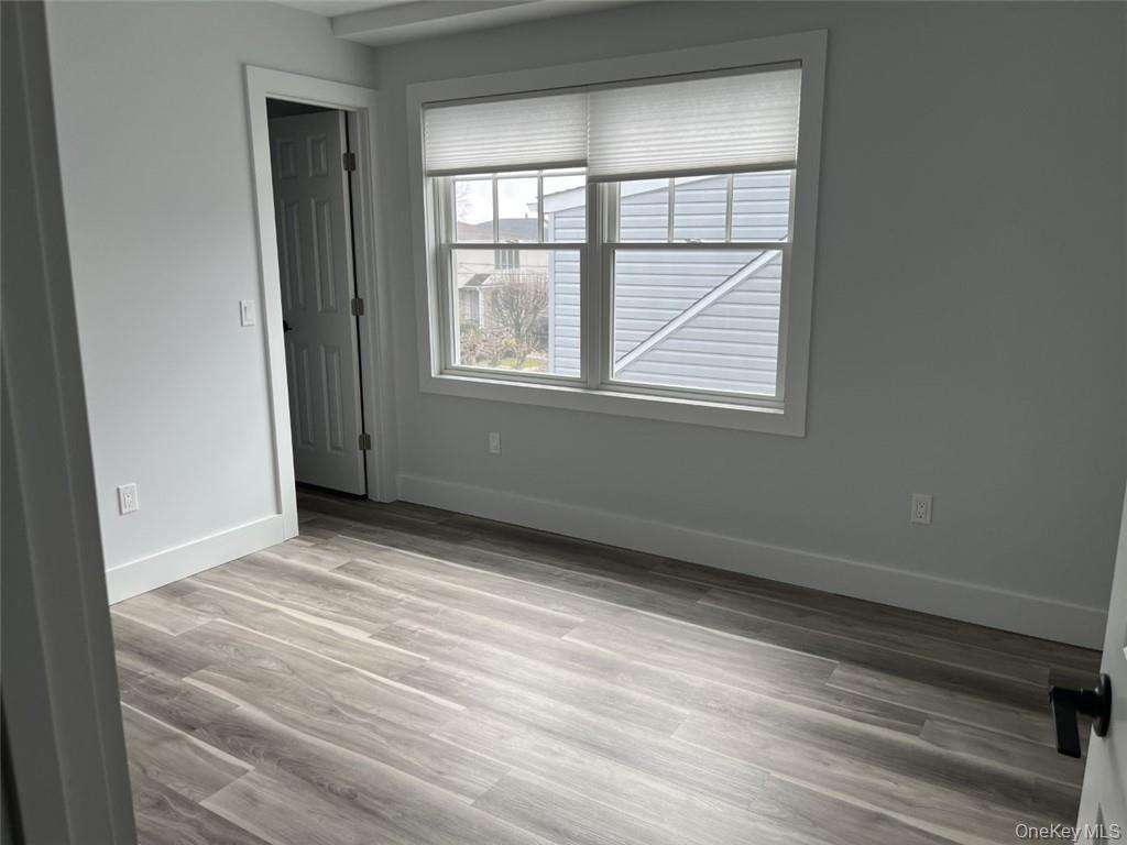 195 Park Avenue, Unit C West Harrison, NY 10604 - Photo 22 of 32 Unfurnished room featuring light wood-style flooring and baseboards