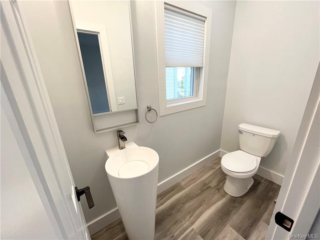 195 Park Avenue, Unit C West Harrison, NY 10604 - Photo 9 of 32 Bathroom featuring wood finished floors and baseboards