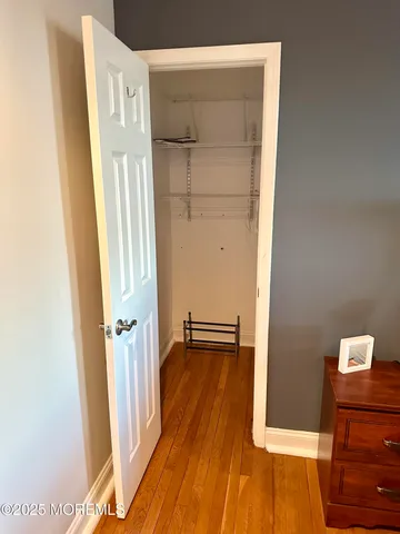 a view of front door with wooden floor