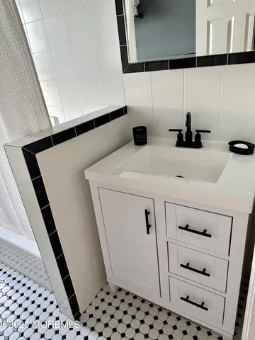 a close view of a sink and dishwasher in a cabinet
