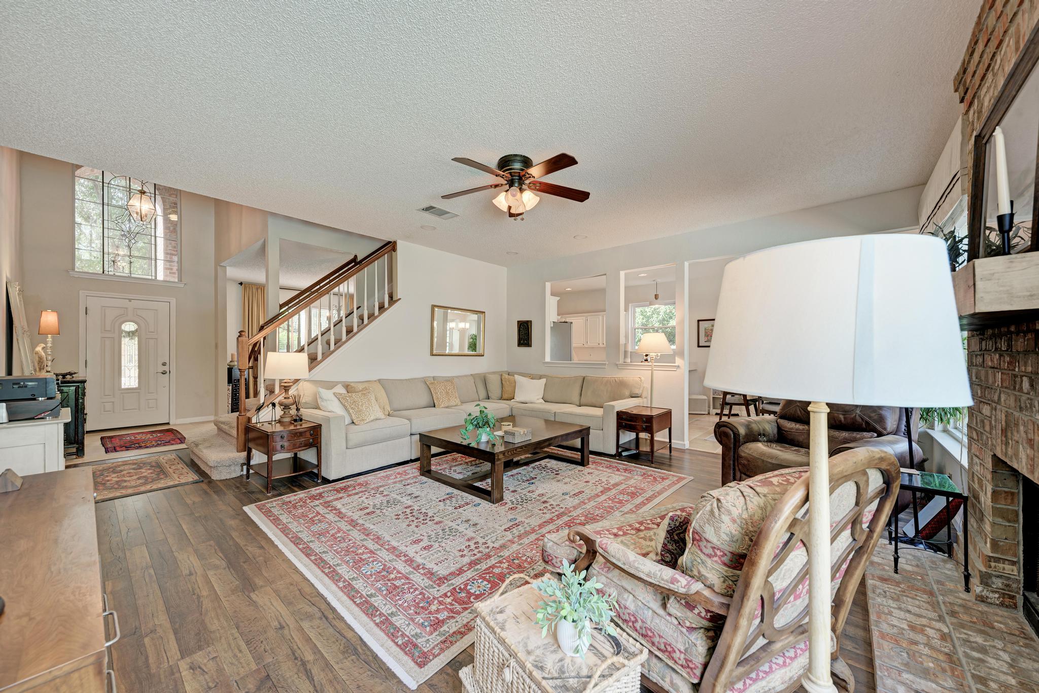 404 Cripple Creek Road Cedar Park, TX 78613 - Photo 11 of 39 a living room with furniture and a chandelier