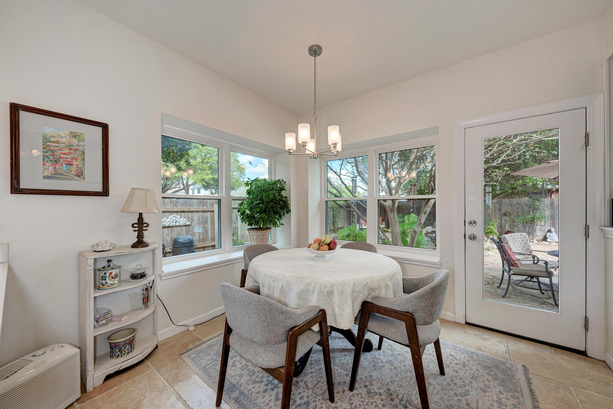 404 Cripple Creek Road Cedar Park, TX 78613 - Photo 14 of 39 a dining room with furniture a chandelier and window