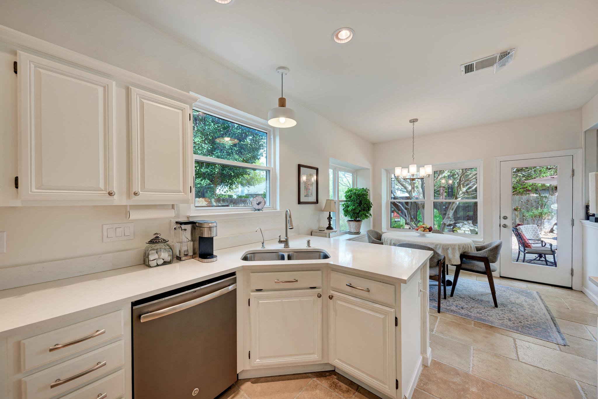 404 Cripple Creek Road Cedar Park, TX 78613 - Photo 18 of 39 a kitchen with sink cabinets and furniture
