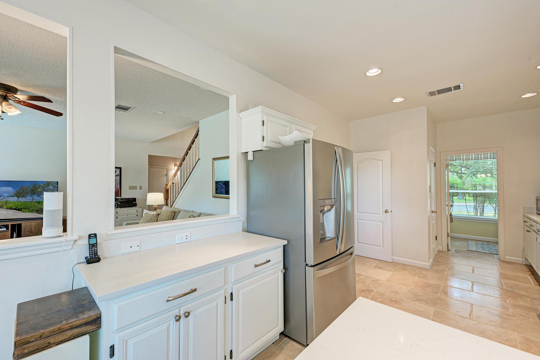 404 Cripple Creek Road Cedar Park, TX 78613 - Photo 20 of 39 a kitchen with a sink stove and refrigerator