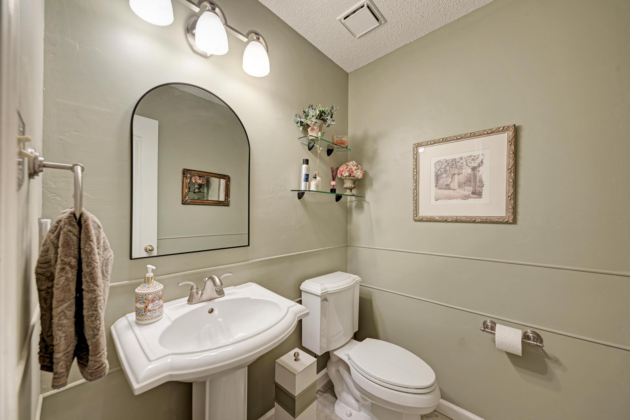 404 Cripple Creek Road Cedar Park, TX 78613 - Photo 25 of 39 a bathroom with a toilet sink and mirror