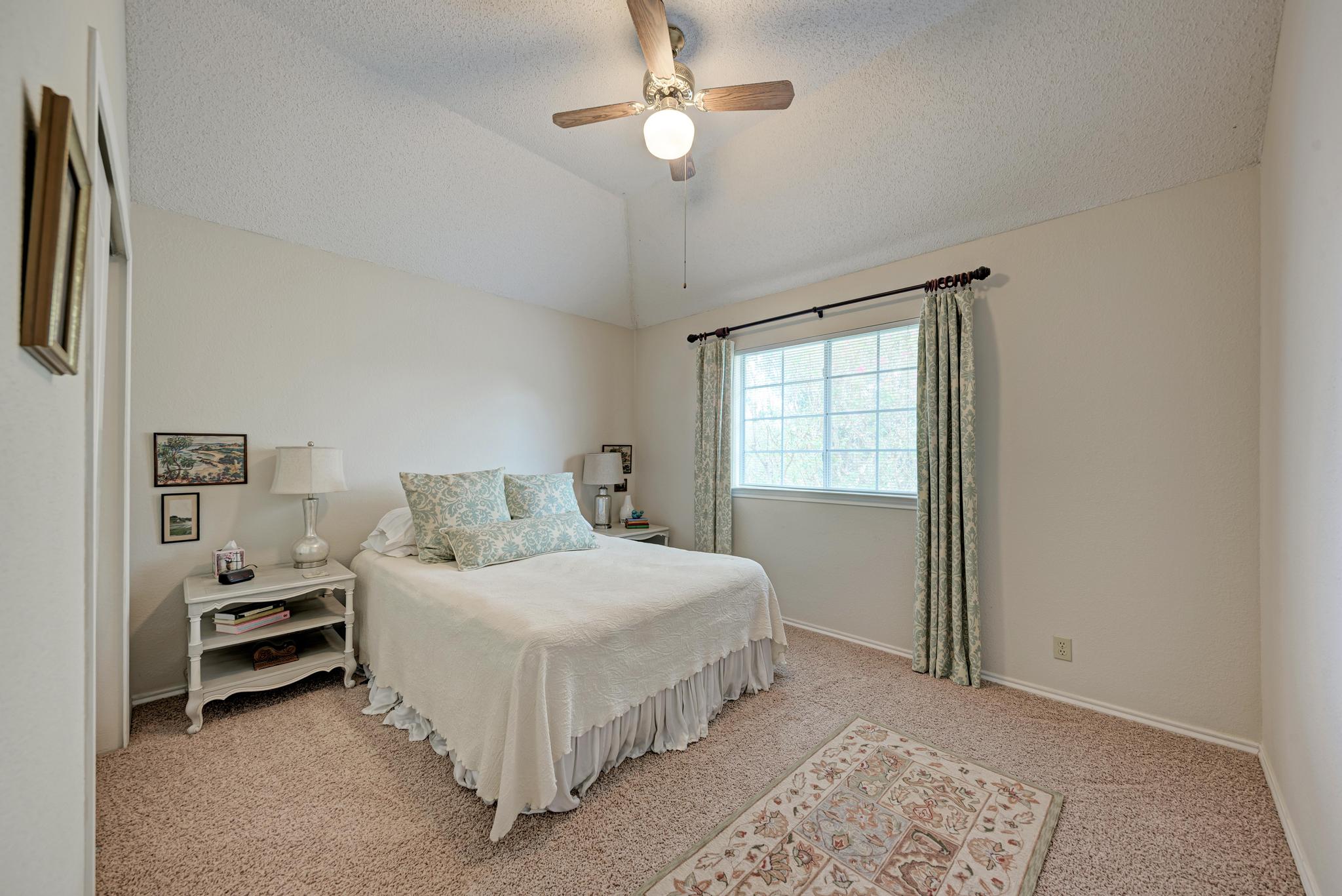 404 Cripple Creek Road Cedar Park, TX 78613 - Photo 30 of 39 a bedroom with a bed and a window