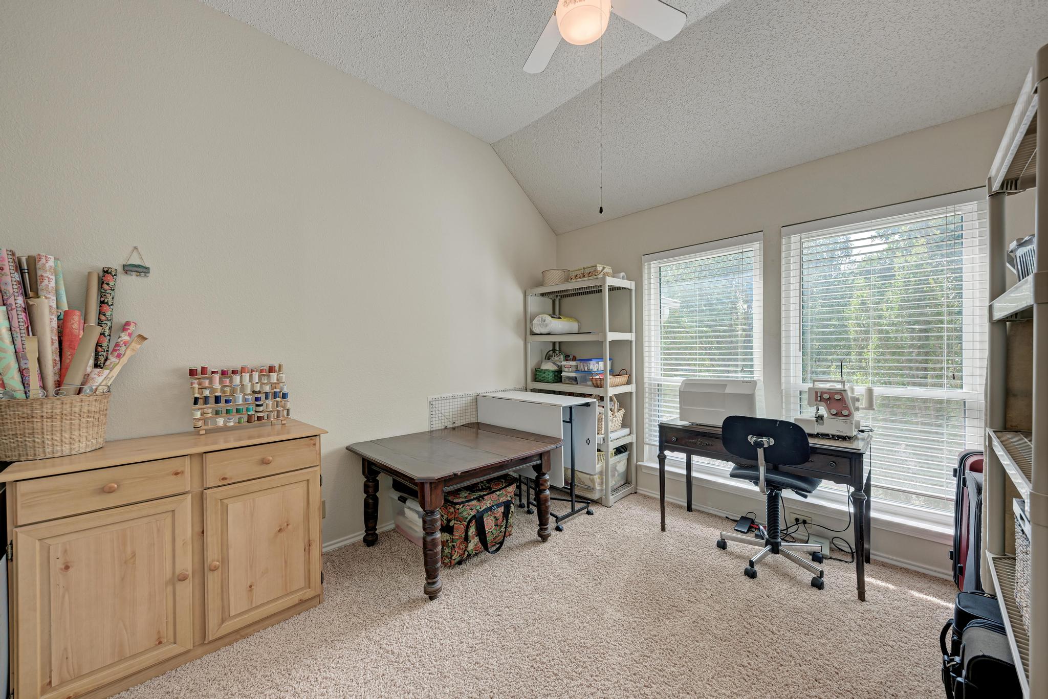 404 Cripple Creek Road Cedar Park, TX 78613 - Photo 31 of 39 a view of a workspace with furniture and a window