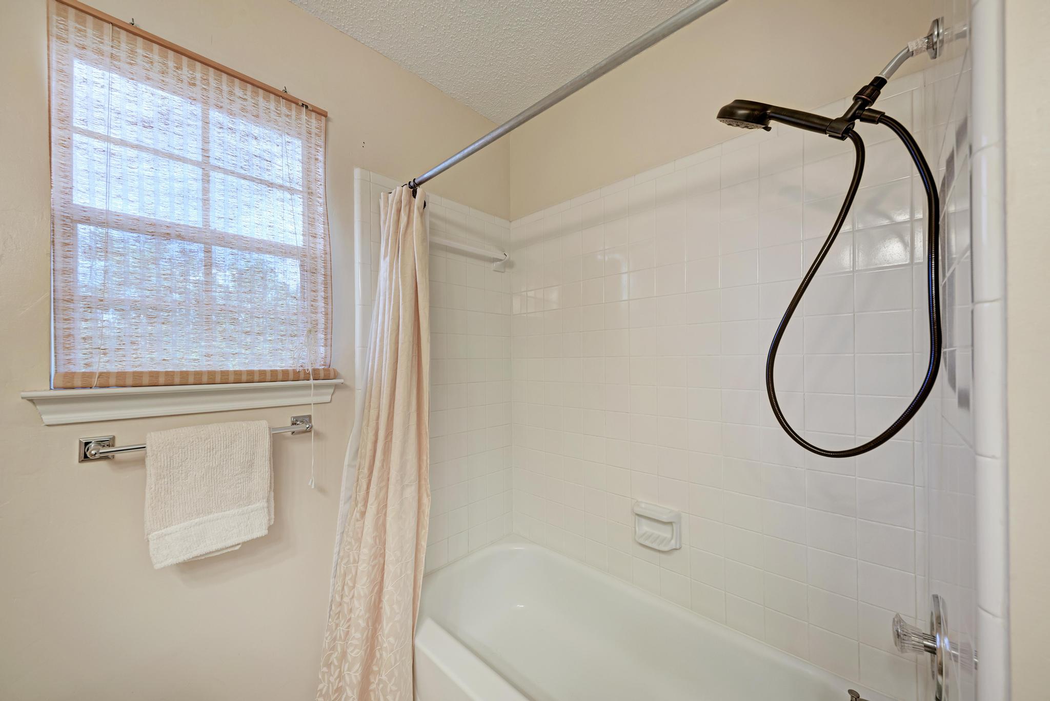 404 Cripple Creek Road Cedar Park, TX 78613 - Photo 34 of 39 Full bathroom with shower / tub combo with curtain and a textured ceiling