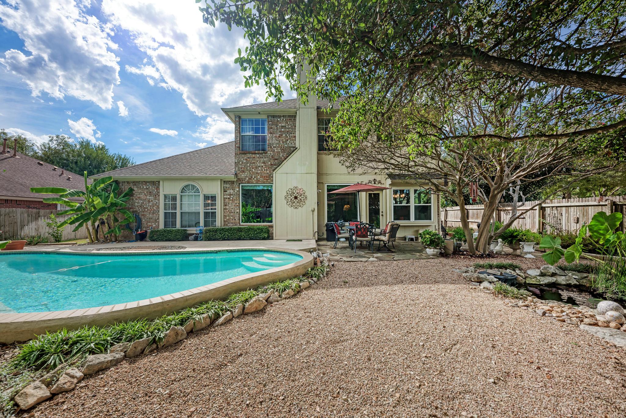 404 Cripple Creek Road Cedar Park, TX 78613 - Photo 37 of 39 a front view of a house with a yard and porch
