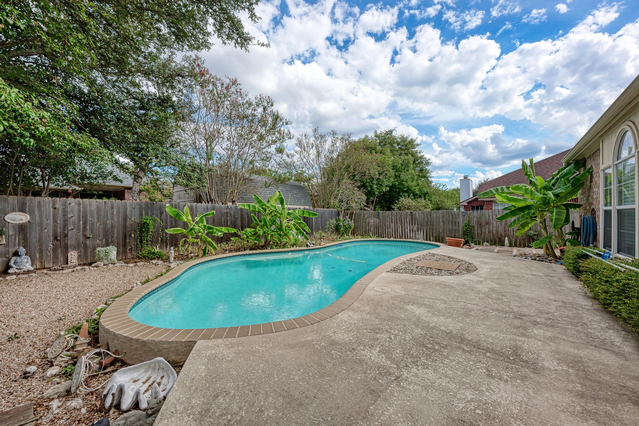 404 Cripple Creek Road Cedar Park, TX 78613 - Photo 5 of 39 a view of a backyard with swimming pool