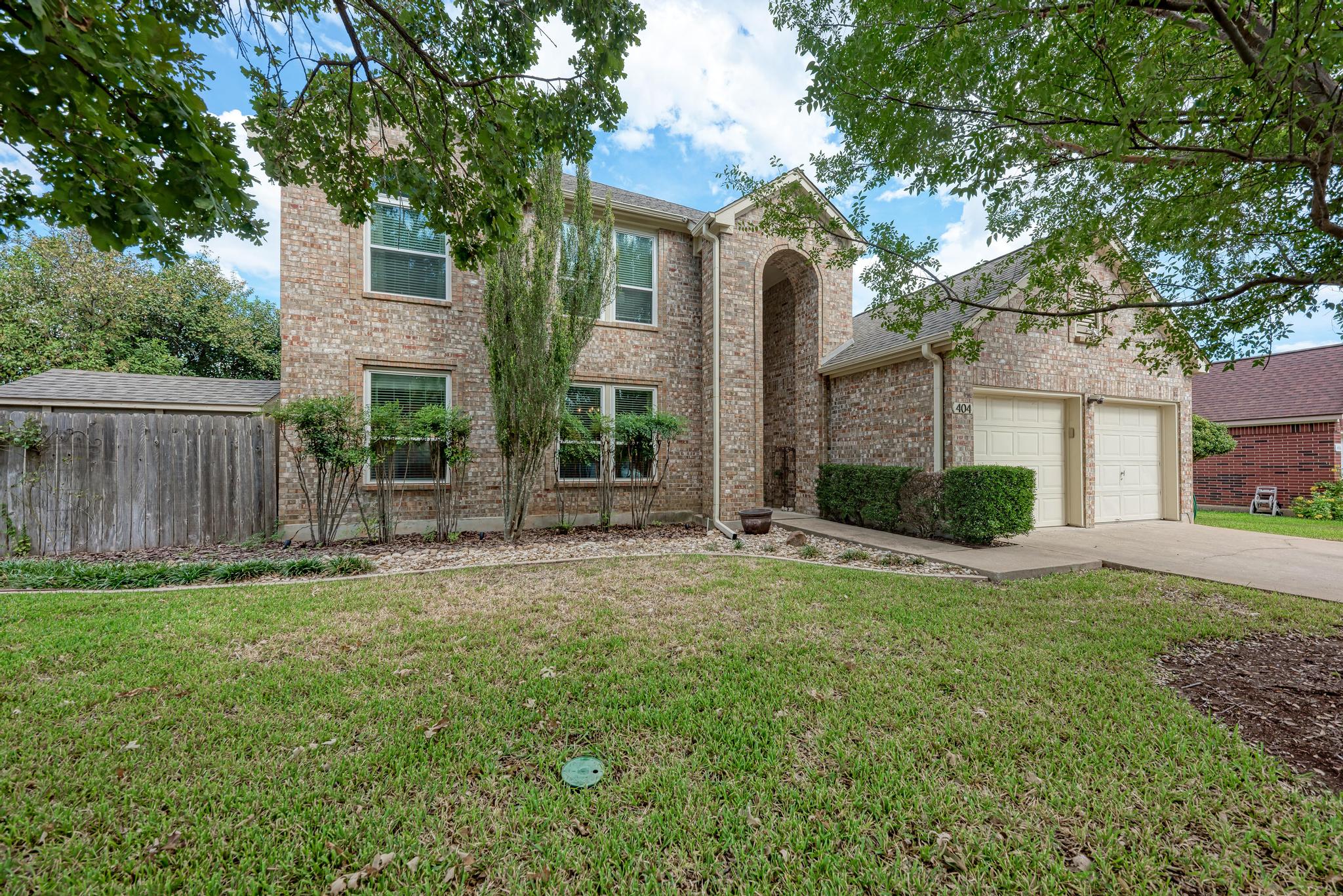 404 Cripple Creek Road Cedar Park, TX 78613 - Photo 6 of 39 Traditional home with brick siding and concrete driveway