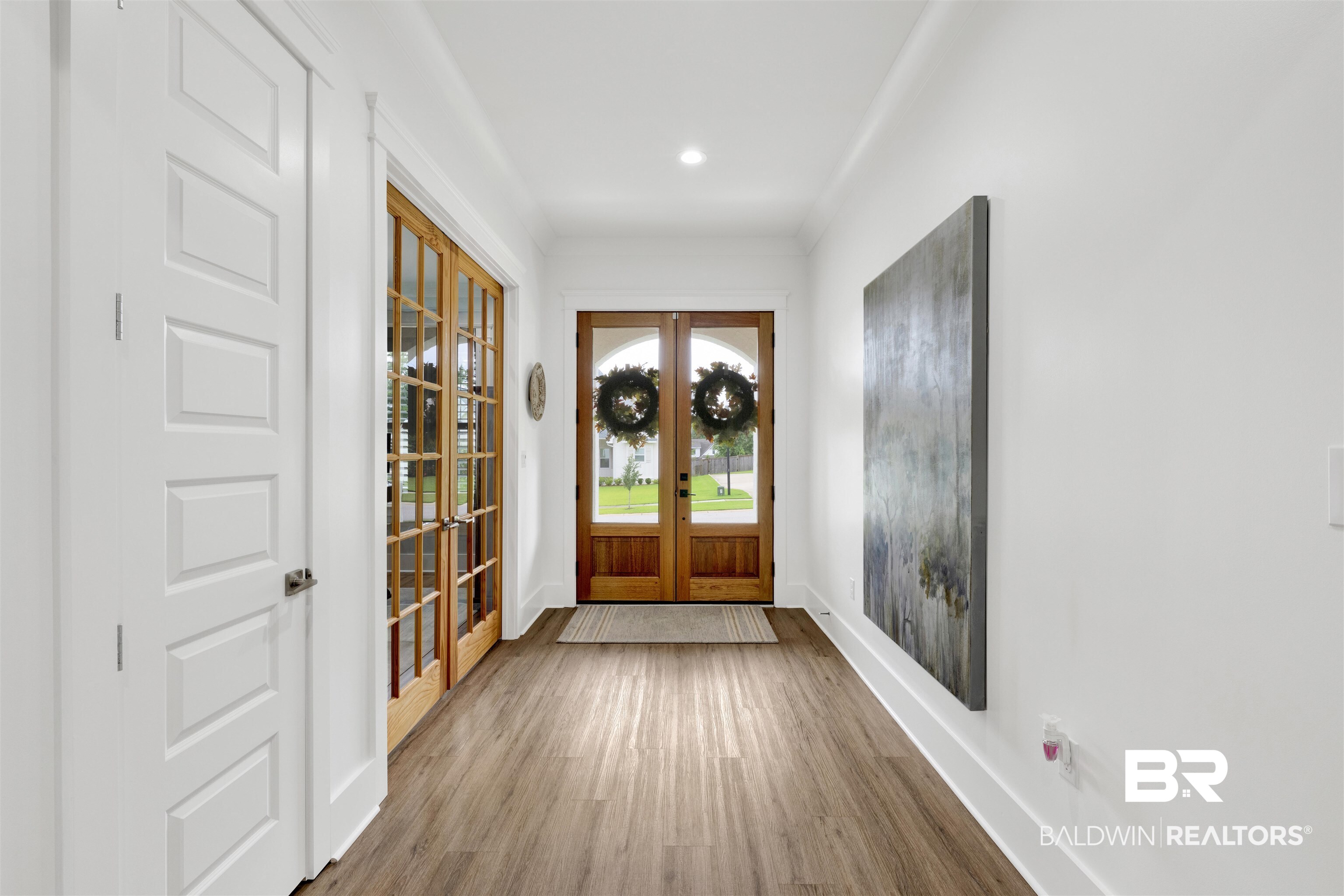 21702 Pillars Street Fairhope, AL 36532 - Photo 3 of 54 Entryway featuring wood-finish flooring, recessed lighting, and a solid wood front door with an arched transom