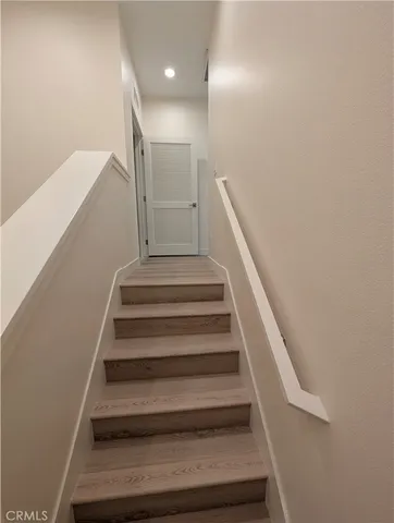 a bathroom with a double vanity sink a toilet and a tub