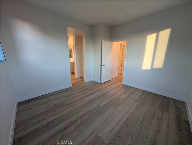 a view of a street with a building in the background