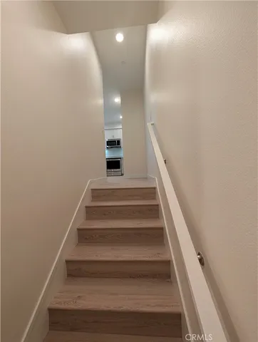 a bathroom with a toilet a sink and a mirror