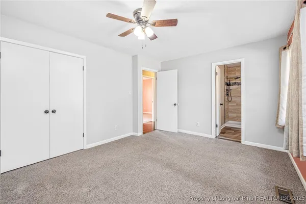 a view of a room with wooden floor and window