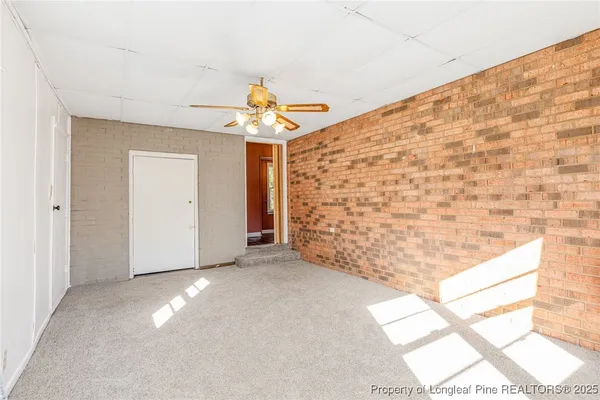 a view of livingroom with window and ceiling fan