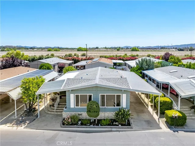 an aerial view of a house with a garden space
